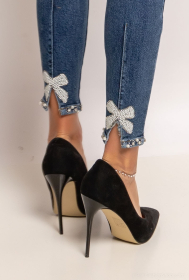 Skinny pearl bow jeans