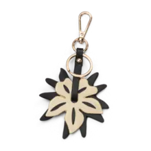 LYCKE Veskecharms Flower svart/gull