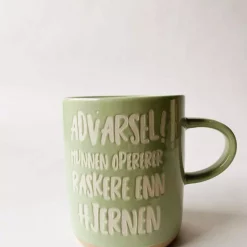 Krus h 9,5 cm "Munn raskere enn hjernen"
