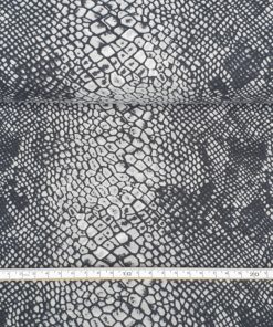 Bomullsjersey i sort og grått slangemønster