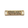 Merke gull metall "Håndlaget" 2,5x0,6cm