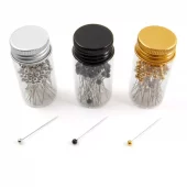 Knappenåler i glasskrukke