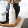 sögne hvit oliven olje flaske